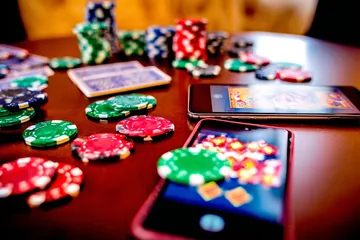 JILI69 App — Fast, responsive, and optimized for all devices A cheerful woman in traditional clothing using her smartphone during a festive moment, showing how easily the JILI69 app fits into everyday life.